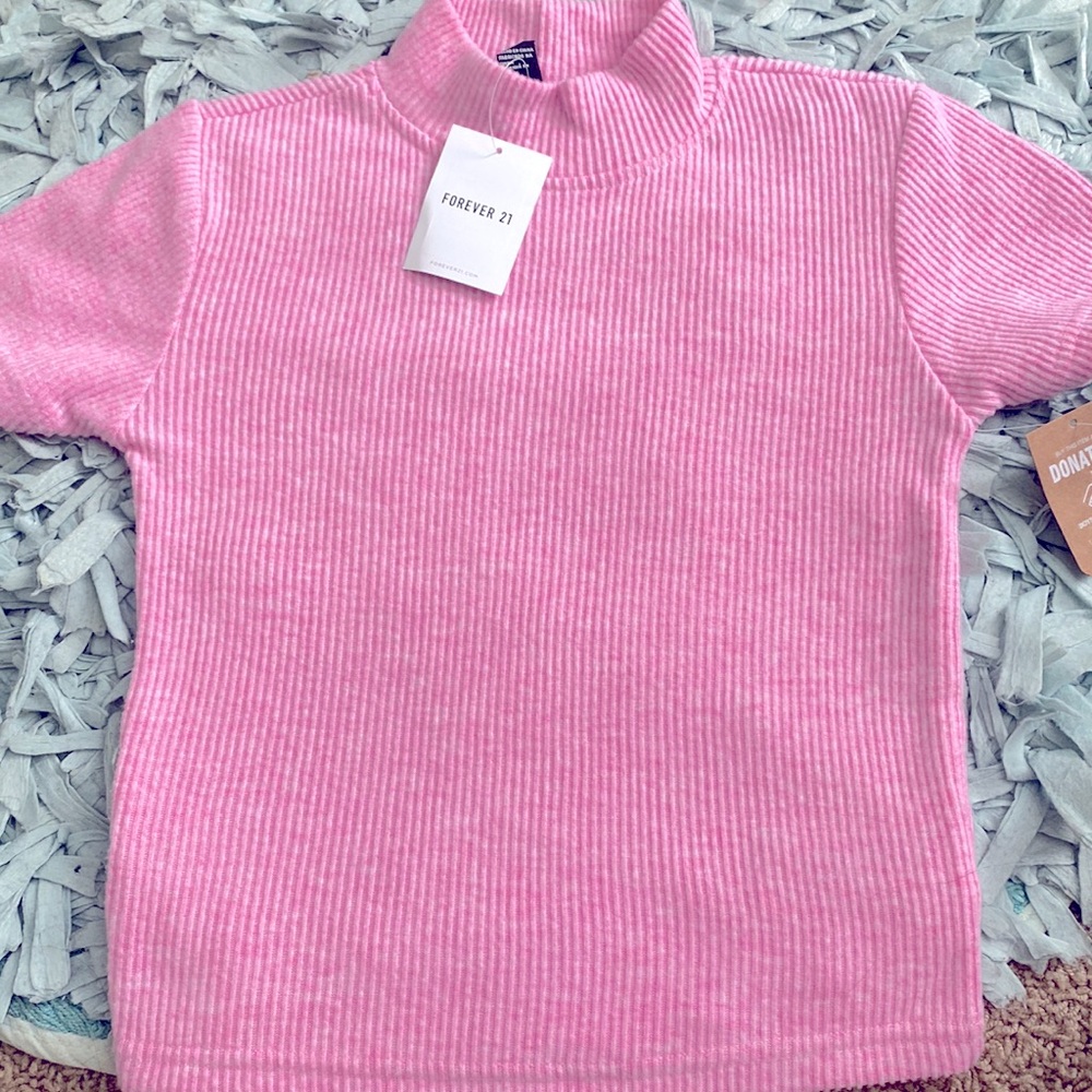 I am selling this pink high crew neck T i got for my birthday.